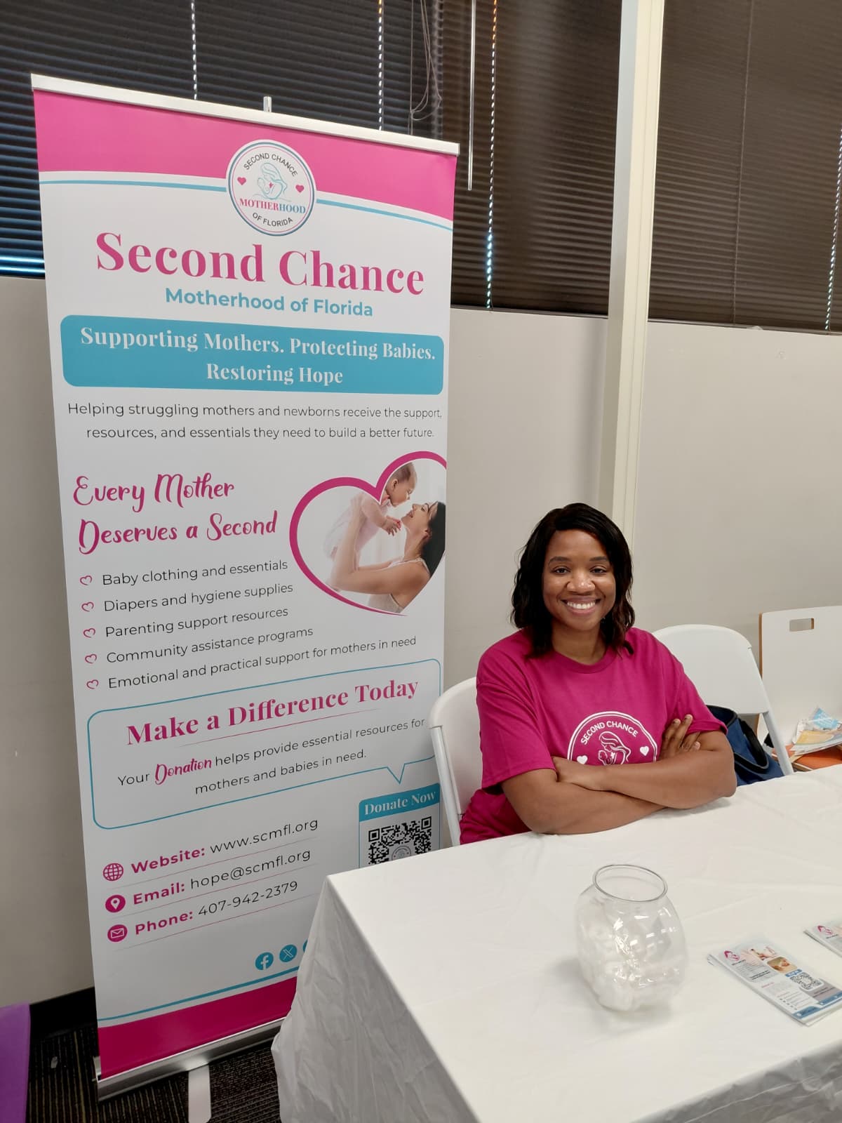 SCMFL founder at Sunshine Health Community Baby Shower table